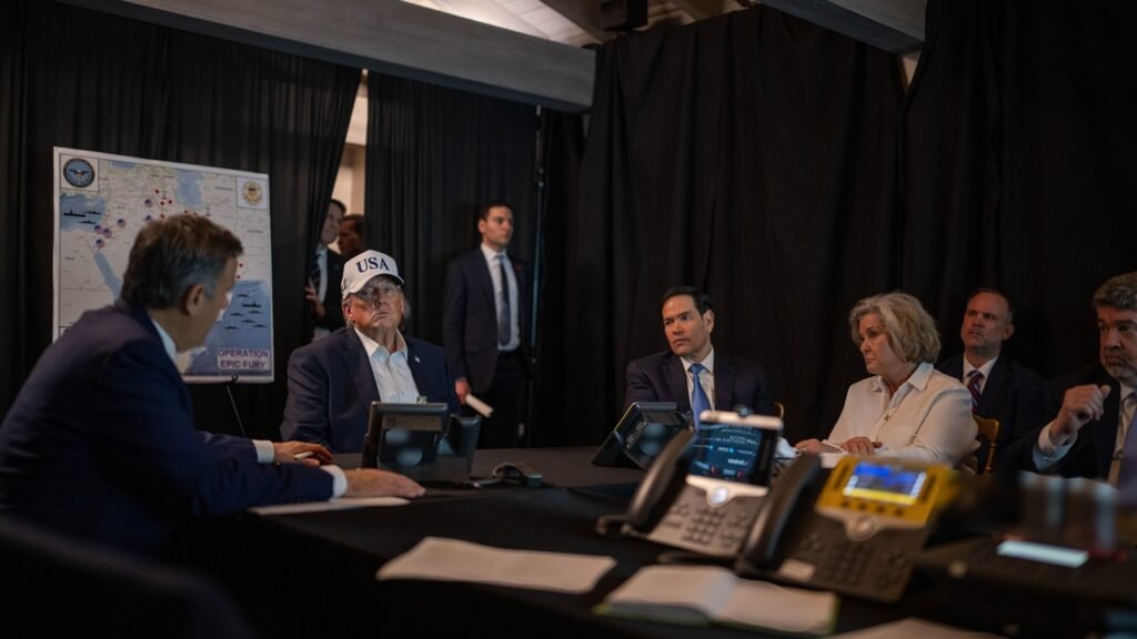 A high-level strategic briefing session featuring political leaders and advisors reviewing a military map of the Middle East, illustrating the decision-making process behind Operation Epic Fury and the debate over its strategic success or failure.