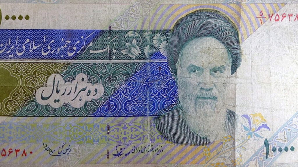 انقلاب ایران به پایان رسیدن در حکومت روحانیون مقدر نبود A close-up of a ten-thousand Iranian Rial banknote featuring the portrait of Ayatollah Ruhollah Khomeini, illustrating the historical symbols and institutional establishment of clerical rule.
