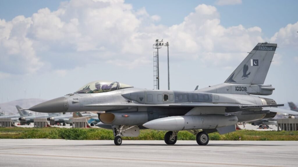 A gray Pakistan Air Force F-16C Fighting Falcon fighter jet taxis along a concrete runway under a cloudy sky, showcasing the military capabilities relevant to analyzing Why Pakistan Deployed Troops in the region.