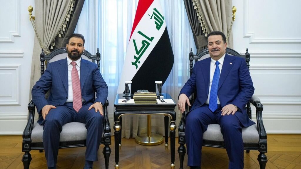 عراق دولتی جدید تشکیل میدهد بدون حل نقش کابینه نیروهای مورد حمایت ایران Iraq's new Prime Minister Ali al-Zaidi sits alongside Mohammed Shia al-Sudani in formal chairs with the Iraqi national flag placed between them, framing the political transitions and the cabinet role of Iran-backed militias.