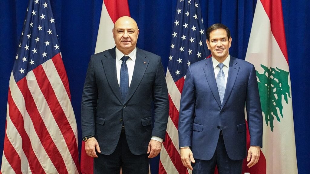 Marco Rubio and a Lebanese diplomatic official standing together in front of United States and Lebanese flags, illustrating the intense international pressure and external involvement influencing modern Iran-Lebanon relations and regional shifts.