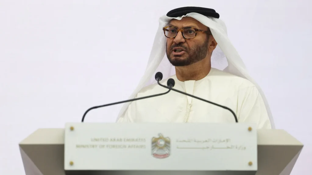 Anwar Gargash, diplomatic adviser to the UAE president, speaks behind a white Ministry of Foreign Affairs podium during a press conference in Abu Dhabi, addressing geopolitical policy and the diplomatic challenges surrounding UAE international law.