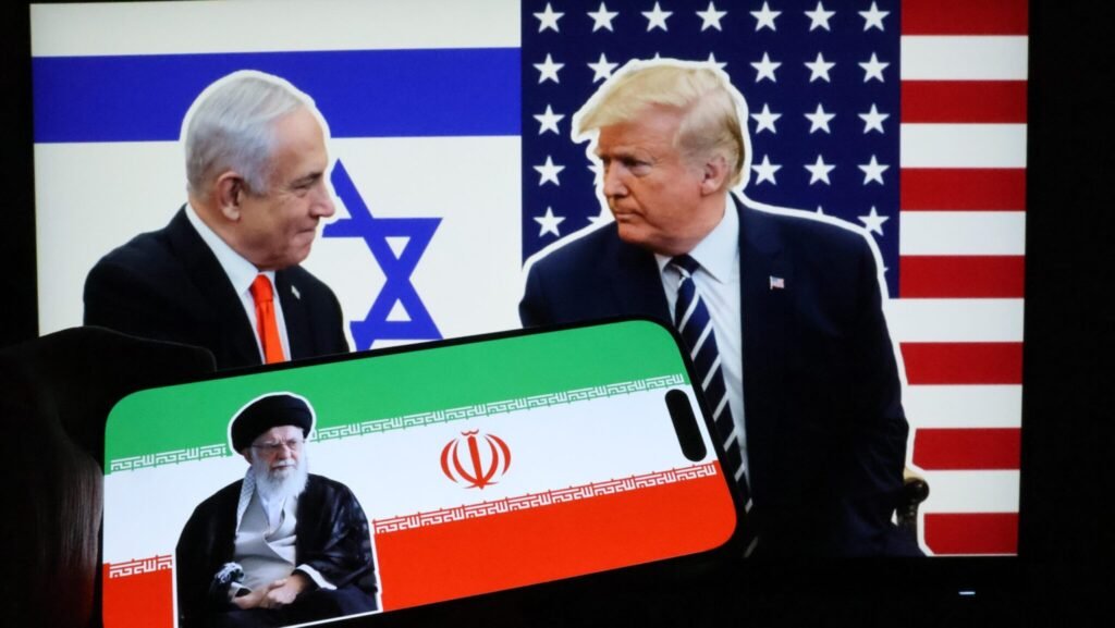 A smartphone displaying a portrait of Iranian Leader Ali Khamenei next to the flag of Iran is held up against a digital screen showing Benjamin Netanyahu and Donald Trump with the Israeli and U.S. flags, contextualizing the international pressure and strategic tensions surrounding Iran Nuclear Infrastructure.