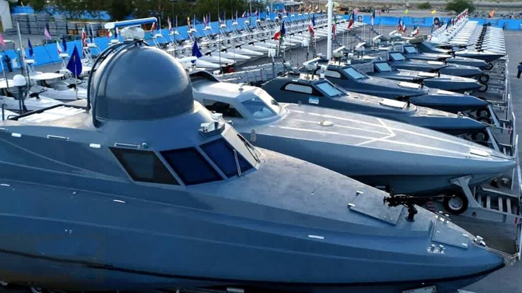 The United States Has Crippled Iran’s Navy. Or Has It? Rows of sleek, gray military fast attack craft equipped with radomes and forward-mounted weapons systems parked on trailers, showcasing the asymmetric defense assets of Iran’s navy that challenge claims of tactical containment.