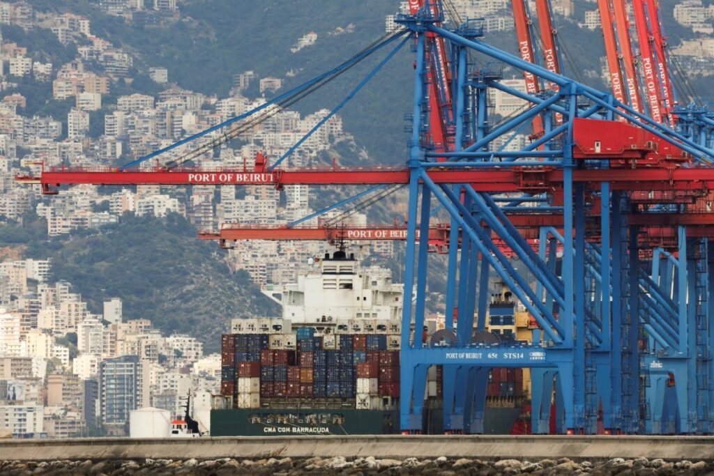 Massive shipping infrastructure and cargo vessels at the Port of Beirut with the dense urban landscape of the Lebanese coast in the background, highlighting the maritime stability and economic potential fostered by the Lebanon-Israel Peace Deal.