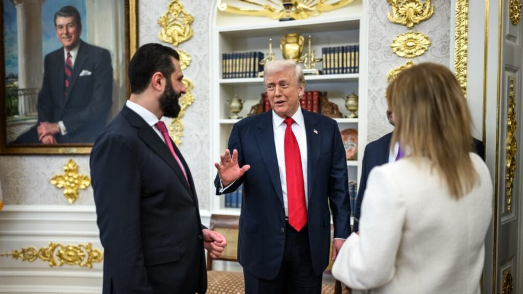 Syria’s Washington Window Won’t Stay Open Forever U.S. President Donald Trump gestures while speaking with Syrian President Ahmed al-Sharaa in the Oval Office, beneath a portrait of Ronald Reagan, reflecting the initial diplomatic channel known as Syria’s Washington Window.