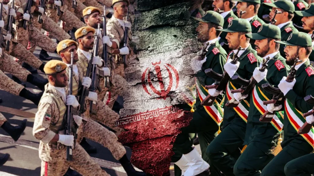 A Shadow Conflict Is Growing Inside Iran’s Armed Forces A divided graphic showing Iranian soldiers marching in desert camouflage on the left and green uniforms on the right, separated by a cracked stone texture bearing the Iranian flag, symbolizing the internal defense structures and tactical depth driving the Iran military rivalry.
