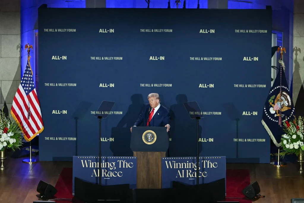 The U.S. Is Losing the AI Credibility War—to Itself President Donald Trump delivers remarks from behind a podium with the Presidential Seal at the "Winning the AI Race" summit during The Hill & Valley Forum, highlighting geopolitical and policy friction in the AI Credibility War.