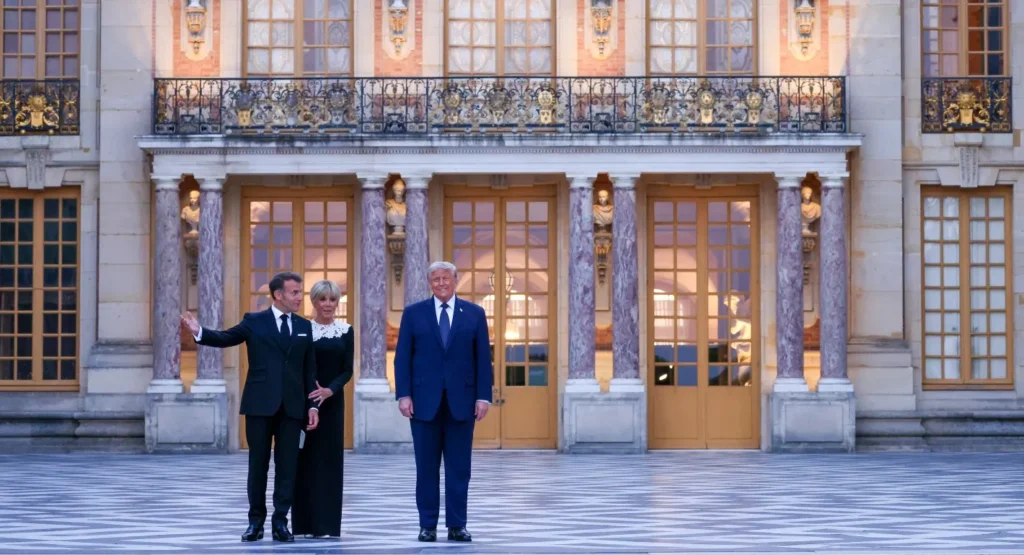 الاتفاق الإيراني الأخير يتجاهل دروس الماضي Donald Trump stands alongside Emmanuel Macron and Brigitte Macron on the grand tiled courtyard outside the Palace of Versailles, capturing the high-profile international diplomacy surrounding negotiations for The Latest Iran Deal.