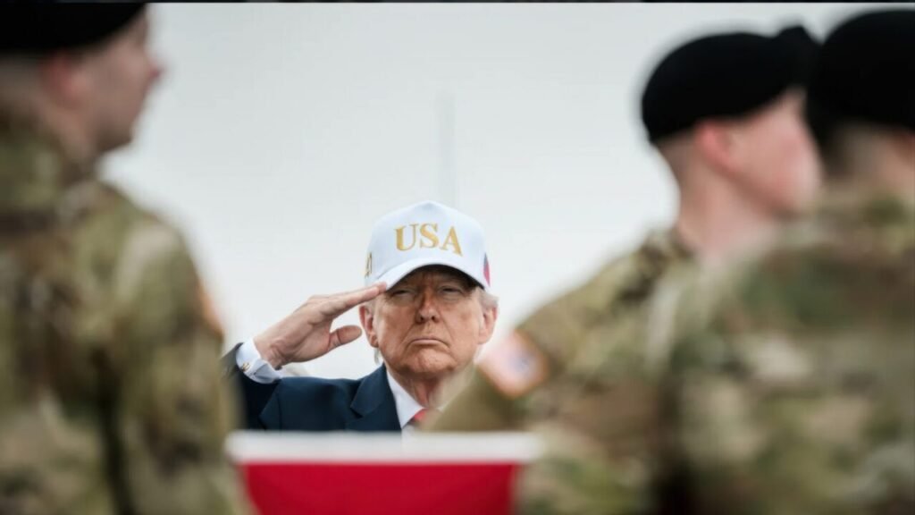 The Iran War’s Incoherent Peace Deal President Donald Trump wears a white USA cap while rendering a solemn salute during a dignified transfer ceremony for fallen soldiers at Dover Air Force Base, providing a somber backdrop to political critiques of an incoherent peace deal.