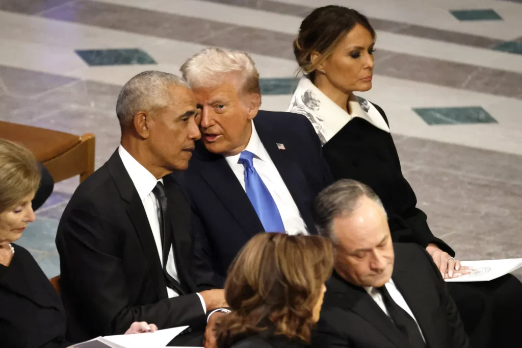 ترامپ میتواند در لبنان موفق شود در حالی که اوباما شکست خورد Donald Trump sits next to Barack Obama and Melania Trump in a formal indoor setting, leaning in to converse, capturing the political figures central to the comparative analysis of a Trump Lebanon Strategy.
