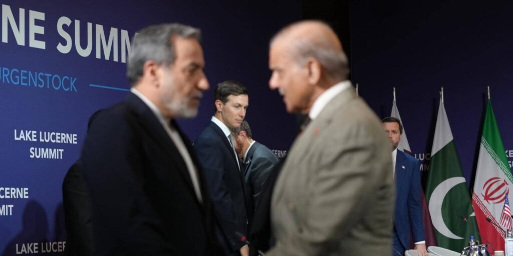 Jared Kushner stands in the center looking on as Iran's Foreign Minister Abbas Araqchi on the left shakes hands with Pakistan's Prime Minister Shehbaz Sharif on the right during the Lake Lucerne Summit, capturing the international diplomatic backdrop of the Iran-US ceasefire.