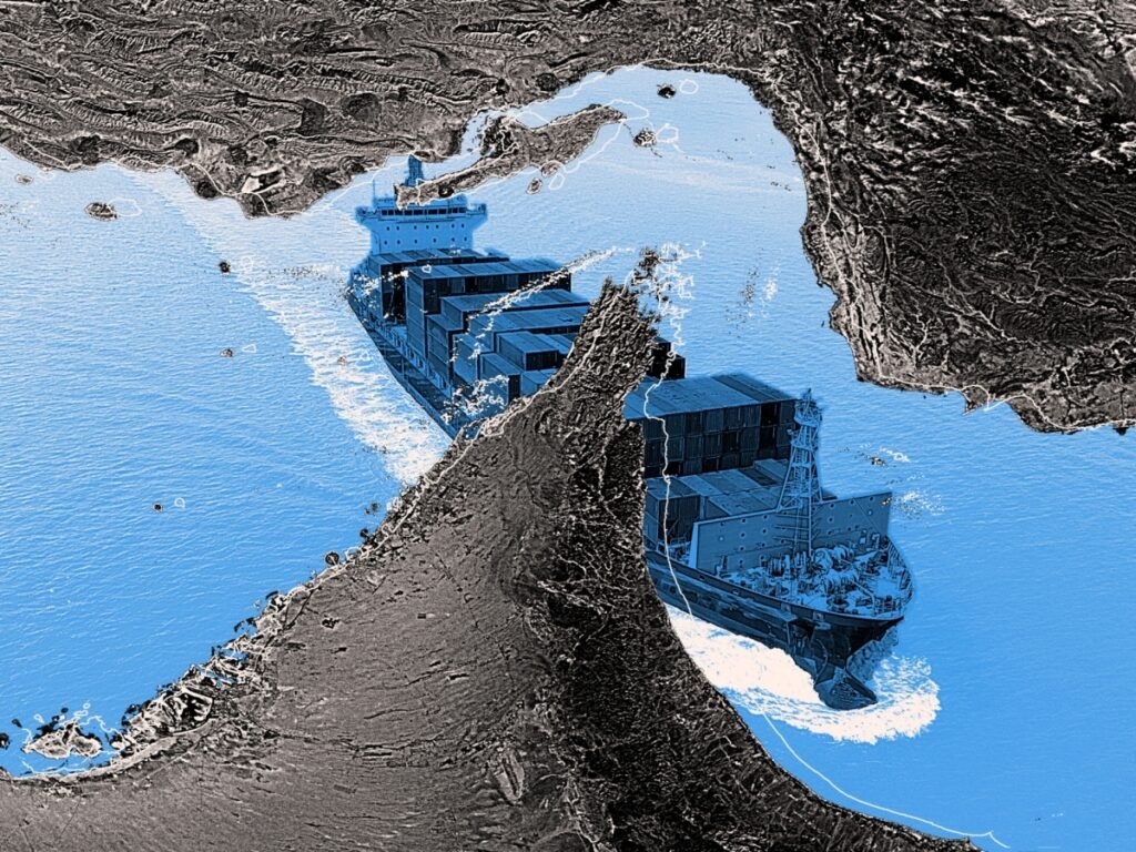 The US war on Iran widened the GCC-Tehran gulf A large commercial container ship navigates through the narrow waters of the Strait of Hormuz on a stylized satellite map backdrop, illustrating the critical maritime chokepoints impacted by a potential US war on Iran.