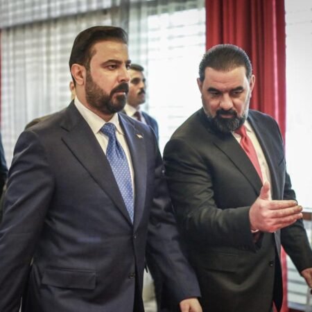 Tempering U.S. Expectations About Iraq’s New Government Iraqi Prime Minister Ali al-Zaidi walking alongside a political colleague who is gesturing with his hand indoors, capturing the internal discussions and structural dynamics shaping Iraq's New Government.