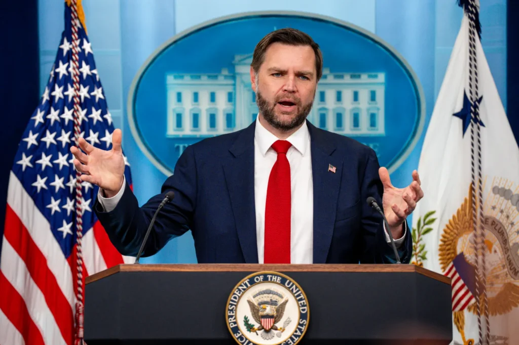The U.S-Iran Deal Draws Skepticism But Requires Open Eyes Vice President JD Vance gestures with open hands while speaking from behind a podium with the Seal of the Vice President during a White House news conference, addressing diplomatic negotiations tied to the U.S-Iran deal.