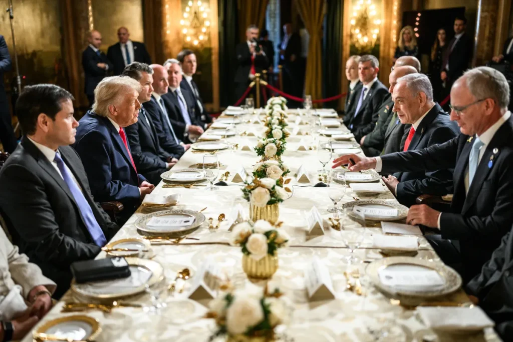 US President Donald Trump and Marco Rubio sit across a long formal dining table from Israeli Prime Minister Benjamin Netanyahu and his delegation during a high-level meeting, demonstrating enduring state ties that persist despite political friction or rumors of a broken alliance with Israel.