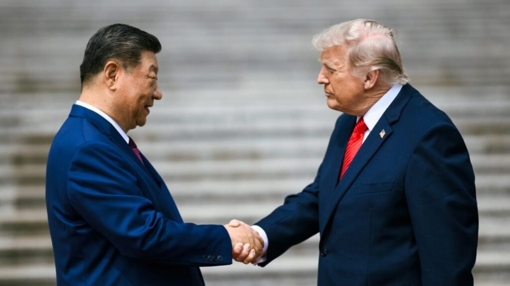 US President Donald Trump in a dark suit and bright red tie shakes hands with Chinese President Xi Jinping in a blue suit during a welcome ceremony at the Great Hall of the People in Beijing, capturing a diplomatic moment connected to the strategic debate surrounding Obama's Mistake.