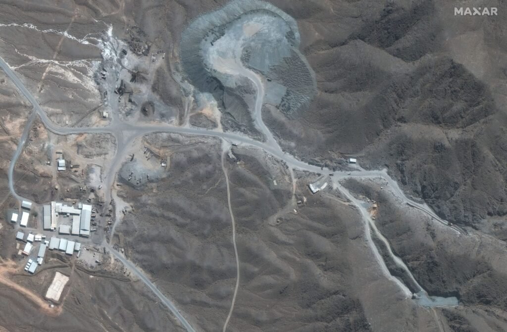 Trump Weighs Strike on Iran’s Pickaxe Mountain Nuclear Site A high-resolution satellite image from Maxar Technologies capturing the arid terrain, access roads, and tunnel portals of the heavily fortified underground facility at Pickaxe Mountain nuclear site.