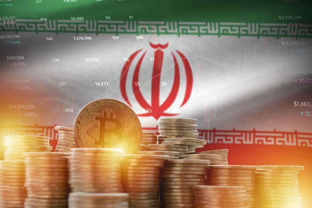 Stacks of gold coins and a shiny Bitcoin token set against a glowing Iranian flag and financial stock chart overlays, illustrating cryptocurrency and illicit finance networks associated with a Sanctions Evader.