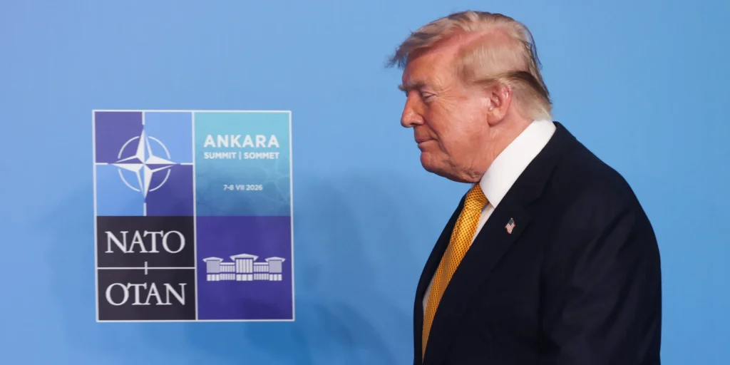 توافق آتشبس دیگر ترامپ با ایران فرو میپاشد Donald Trump walking in profile past a blue NATO Ankara Summit backdrop, reflecting high-stakes multilateral diplomacy surrounding a Trump Ceasefire.
