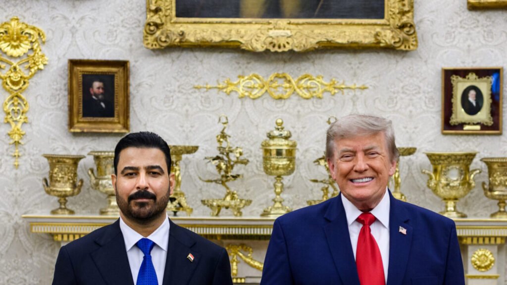 A close-up shot of Iraqi Prime Minister Ali al-Zaidi and US President Donald Trump posing together during a formal meeting at the White House, serving as a visual counterpoint to ongoing discussions regarding the necessity of addressing Iraq corruption.