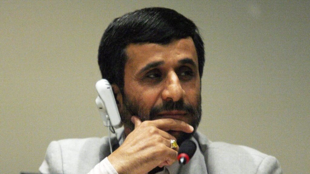 Did Israel Groom Mahmoud Ahmadinejad as Iran’s Next Leader? A close-up portrait of former Iranian President Mahmoud Ahmadinejad listening during an international meeting, representing the historical context surrounding the subject of his political leadership.
