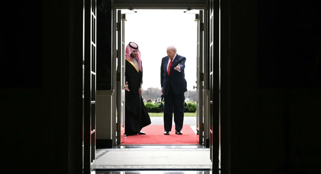 Inside the Risky U.S.-Saudi Nuclear Deal: What You Must Know Donald Trump gesturing welcomingly toward Saudi Crown Prince Mohammed bin Salman at an open doorway along a red carpet, underscoring high-level diplomatic negotiations surrounding a U.S.-Saudi Nuclear Deal.