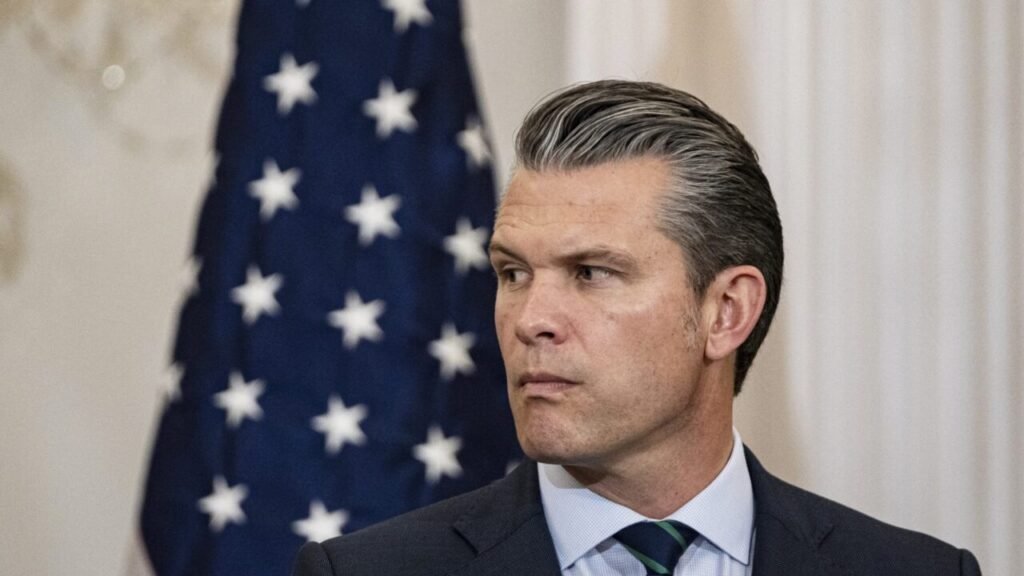 Congress defense budget delay hurts national security US Secretary of Defense Pete Hegseth speaks at a Pentagon press conference about the defense budget delay, with the American flag in the background.