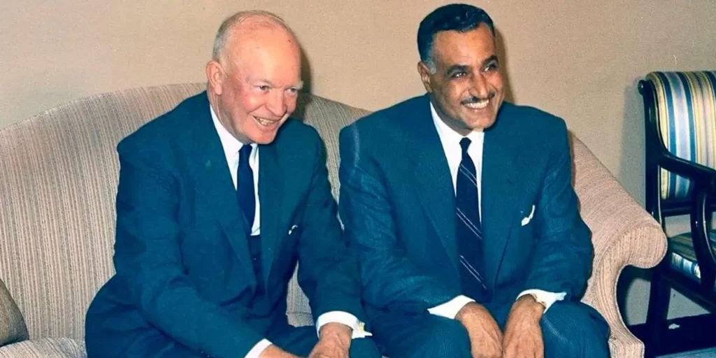 Strait of Hormuz deal demands US accept Iran’s role Historical photograph of US President Dwight D. Eisenhower and Egyptian President Gamal Abdel Nasser sharing a laugh while sitting together on a sofa, symbolizing the vital diplomatic rapprochement required between global powers and influential regional leaders to successfully finalize a Strait of Hormuz deal—a negotiation that inherently demands the United States fully accept and accommodate Iran's strategic role in regional maritime security.