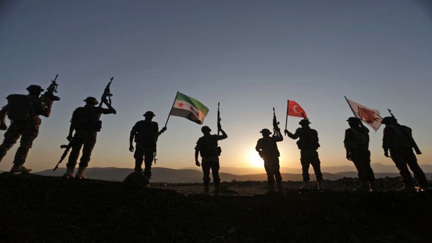Turkey Syria Ties Alarm Israel in 5 Critical Ways A dramatic silhouette of armed soldiers standing on a hilltop at sunset, brandishing the Turkish flag alongside the Syrian opposition flag, representing the deepening military alliance and border security challenges posed by Turkey Syria Ties that alarm Israeli defense officials in five critical strategic areas.