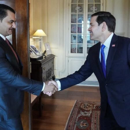 US Secretary Marco Rubio shakes hands with a Libyan envoy during a diplomatic meeting, illustrating the high-level engagement behind the controversial US Libya Plan.