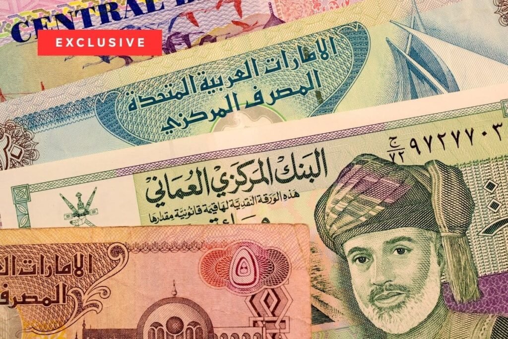 Tax-Free Gulf Salaries Strategy Keeps Them Untouchable Close-up of UAE Dirham and Omani Rial banknotes with an "EXCLUSIVE" red graphic overlay, visually representing the wealth accumulation and financial advantages that make Tax-Free Gulf Salaries a highly attractive strategy for professionals seeking untouchable savings and long-term economic security in the region.