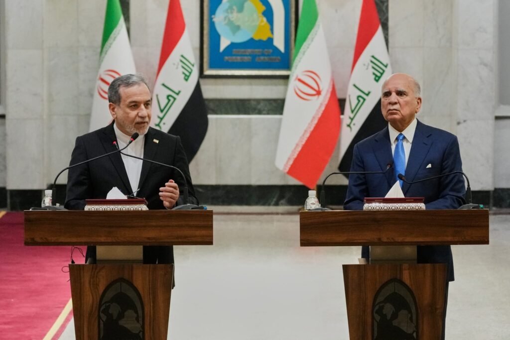 Iranian Foreign Minister Abbas Araghchi and Iraqi Foreign Minister Fuad Hussein address a joint news conference in Baghdad, highlighting evolving dynamics surrounding Iranian influence in Iraq.