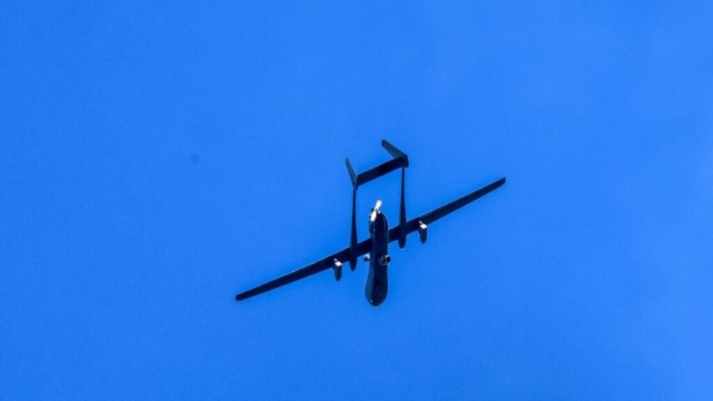 Drone defense strategy binds US, Ukraine, and Israel An Israeli military surveillance drone flying against a clear blue sky, highlighting the advanced aerial capabilities integrated into a joint drone defense strategy shared among the US, Ukraine, and Israel.