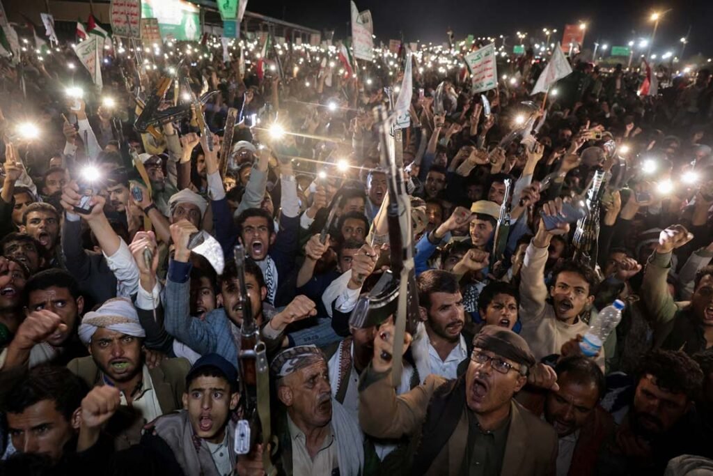 Armed Houthi supporters demonstrate in Sanaa as the Saudi-Houthi truce unravels over Yemen airspace control.