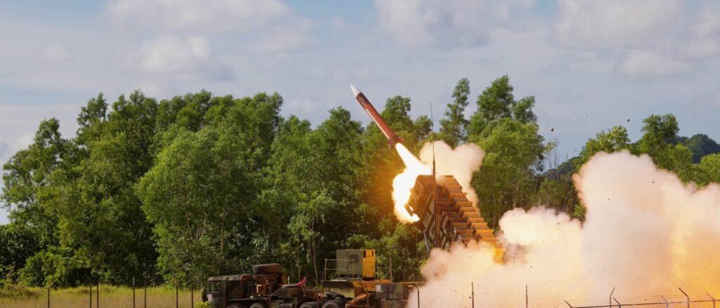 A missile launches from an air defense system amid concerns over a US munitions shortage and strategic vulnerability.