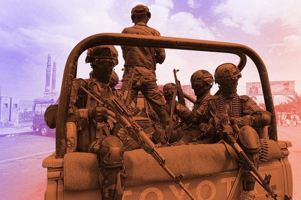 إيران في اليمن: دفع الحوثيين نحو حرب أوسع Heavily armed soldiers in tactical gear and goggles ride in the back of a Toyota pickup, one standing above the roll bar, set against a reddish overlay with a mosque's minarets and street billboards behind them — a scene reflecting the expanding role of Iran in Yemen as it pushes Houthis into a wider war.