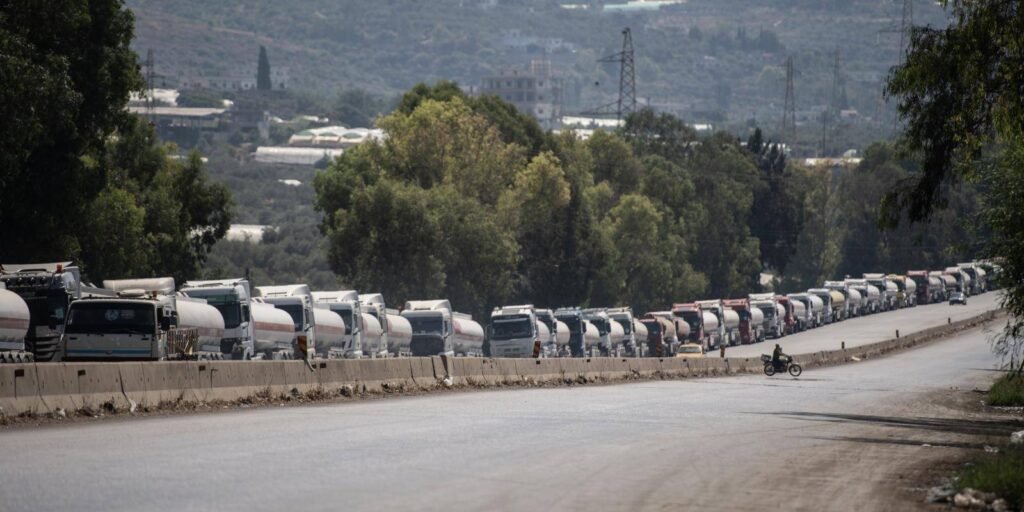 Oil tanker trucks queued at Banyas terminal in Syria highlighting Hormuz Bypass plans.