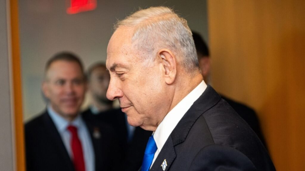 Israeli Prime Minister Benjamin Netanyahu in a dark suit and blue tie looks downward at the UN, a visual reminder that Gaza withdrawal fails even if Netanyahu loses.