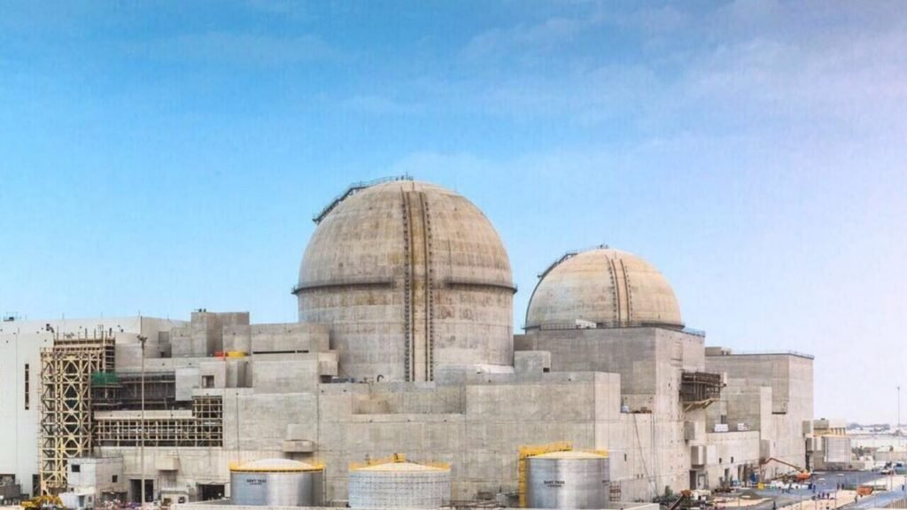 A photograph of the Barakah nuclear power plant under construction in Abu Dhabi, featuring two large concrete containment domes and scaffolding, serving as a stark visual proxy for the potential infrastructure that underscores the Saudi Reactor Vulnerability to missile and drone strikes, a critical threat that is glaringly ignored in the current US nuclear deal.