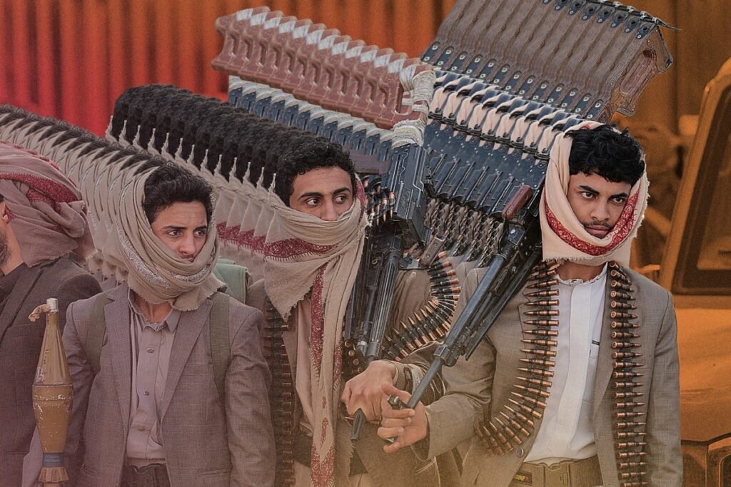 Armed Houthi fighters carrying heavy machine guns in formation showcasing the Houthi-Iran Alliance.