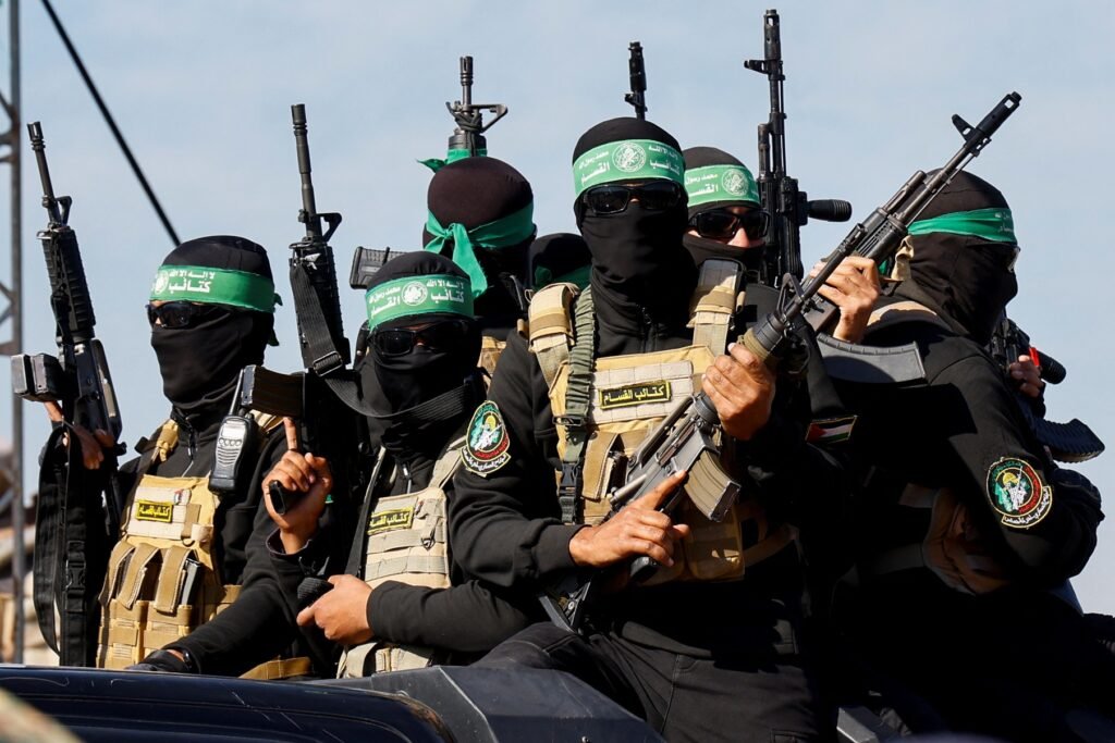 Masked Hamas fighters holding rifles in Gaza, illustrating the decline in Palestinian public opinion on Hamas winning.