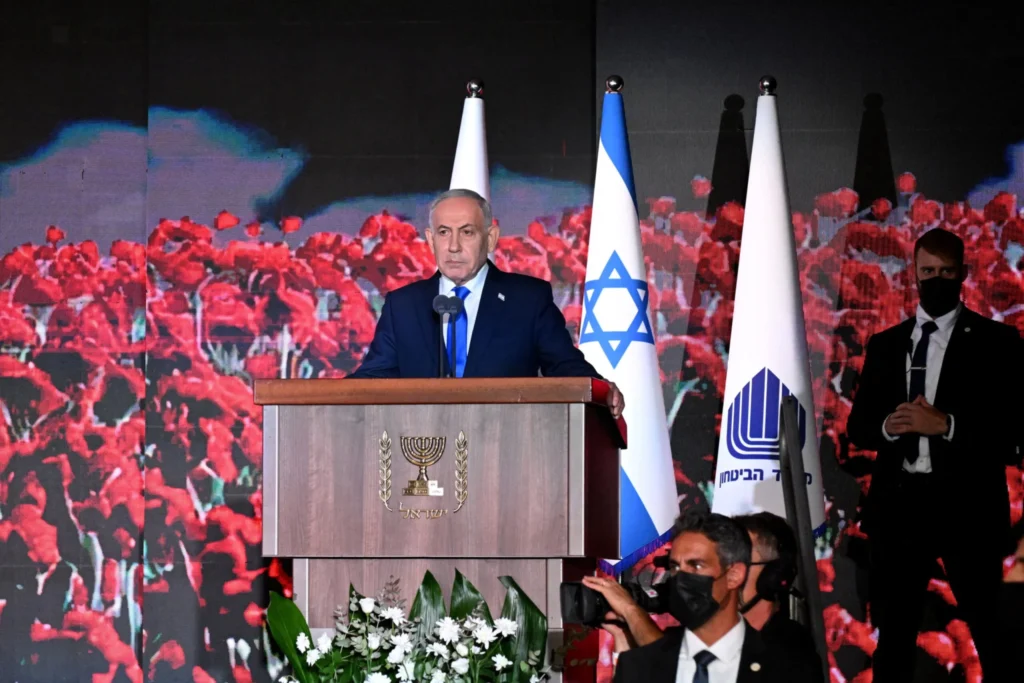 Israeli PM Benjamin Netanyahu speaks at a memorial ceremony, reflecting the political fight over the October 7 Inquiry