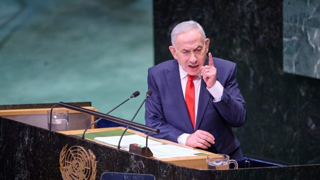 Israeli Prime Minister Benjamin Netanyahu gesturing emphatically with a raised finger at the UN General Assembly podium, illustrating political campaigns ahead of Israeli elections and Netanyahu Reelection prospects.