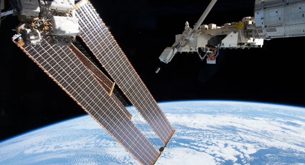 The Light-1 CubeSat deployed into Earth orbit from a space station robotic arm, highlighting orbital satellite vulnerabilities amid growing concerns over ASAT weapons and a space arms race.