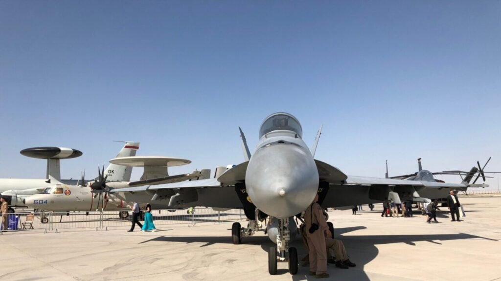 US military aircraft including an F/A-18 fighter jet and an E-2 Hawkeye on display, representing the military capabilities needed to secure Freedom of Navigation in the Red Sea.