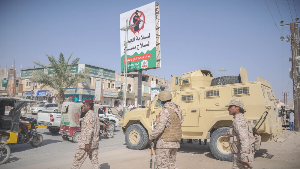 Iranian Proxies Act as One While the West Stays Divided Saudi-backed Yemeni Army soldiers standing near an armored vehicle at a security checkpoint in Hadramaut, illustrating the divided regional front while Iranian Proxies act as one.