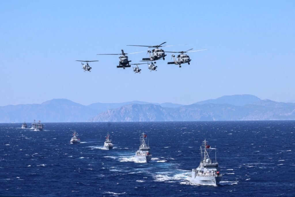 Turkish Navy warships and helicopters in formation during a Mediterranean exercise, illustrating how Turkey diplomacy navigates a US security vacuum.