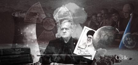 Iranian President Masoud Pezeshkian stands at a podium holding a framed portrait of the late Ayatollah Khamenei, surrounded by NPT treaty books, a nuclear cooling tower, a globe, and the UN flag — the visual arena of the Iran NPT Withdrawal debate.