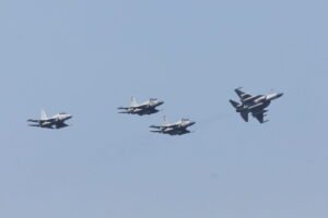 Pakistani JF-17 Thunder jets flying in formation against a clear blue sky, symbolizing the military cooperation behind the Saudi-Pakistan Defense Pact drawing Islamabad into Yemen.